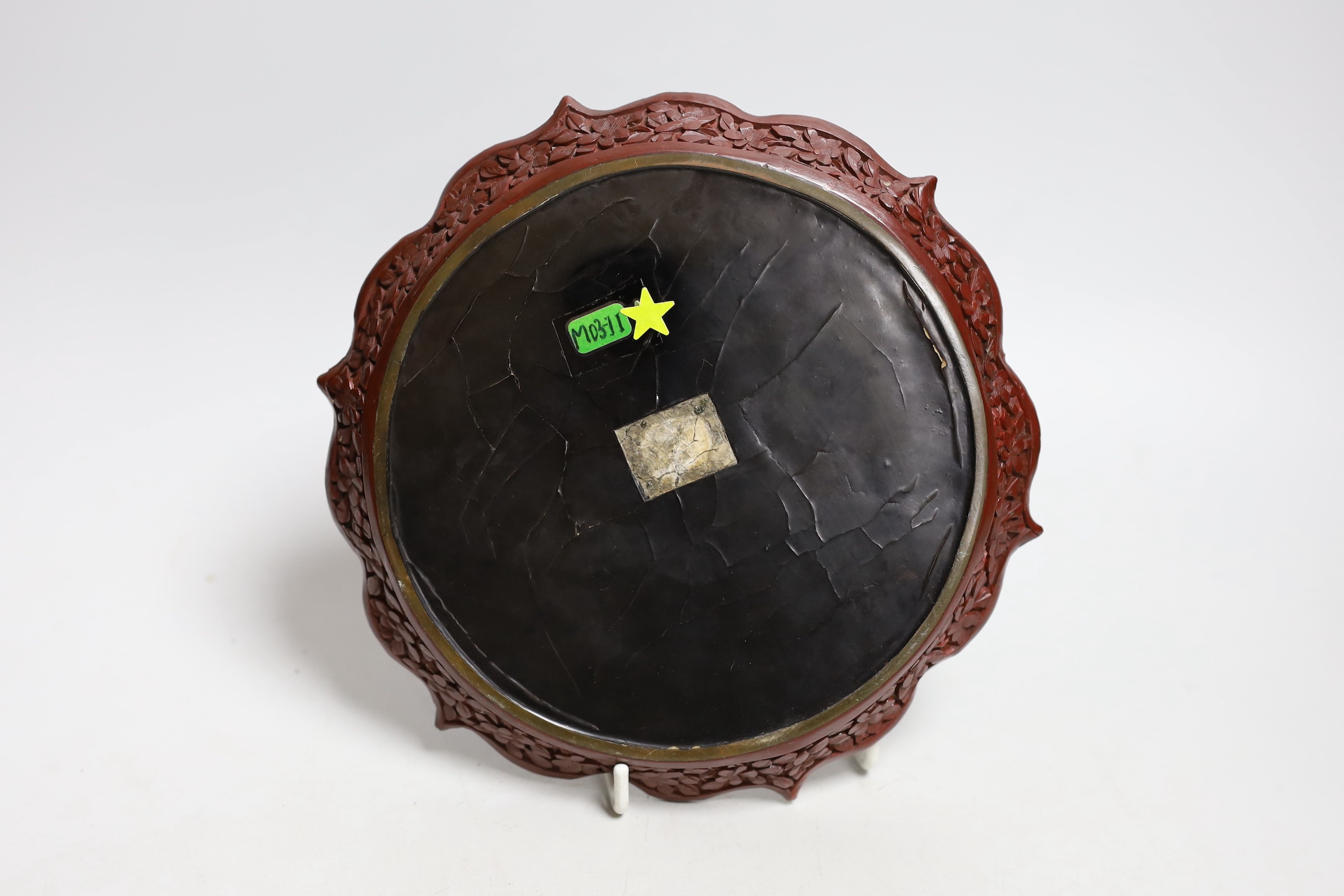 An early 20th century Chinese cinnabar lacquer dish, 29.5cms diameter